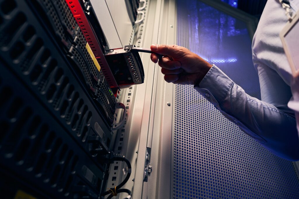 Experienced data center IT technician installing HDD