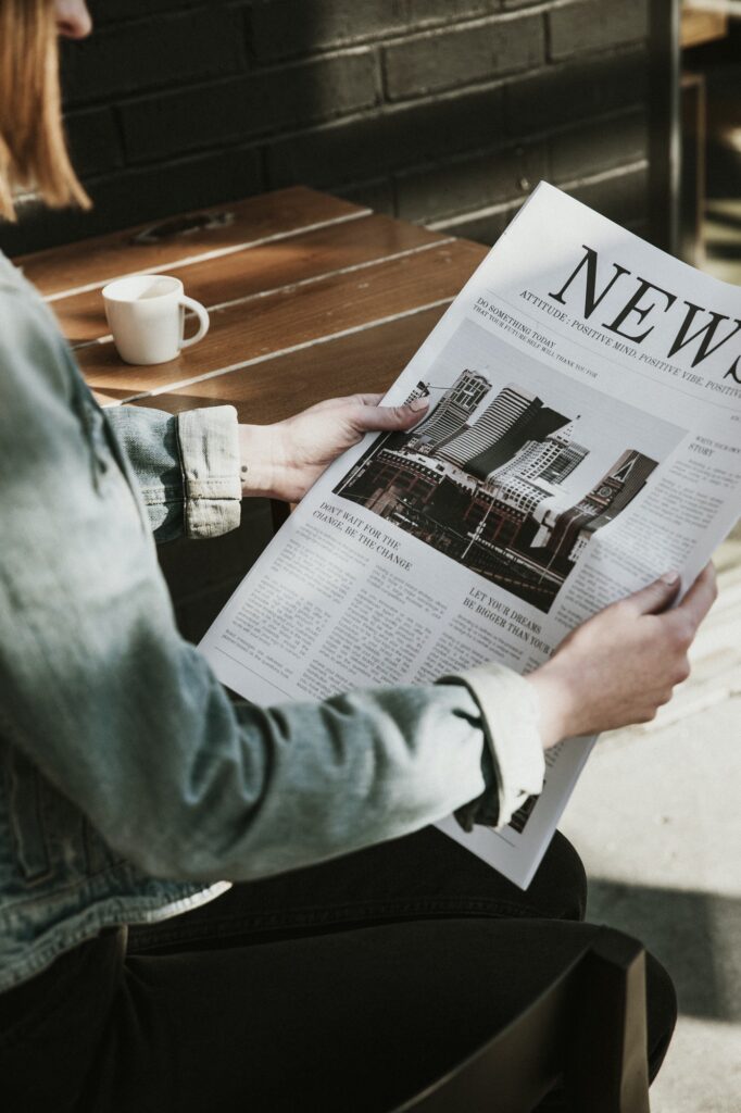 Woman reading paper news